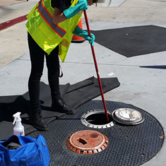 Worker cleaning a spill bucket